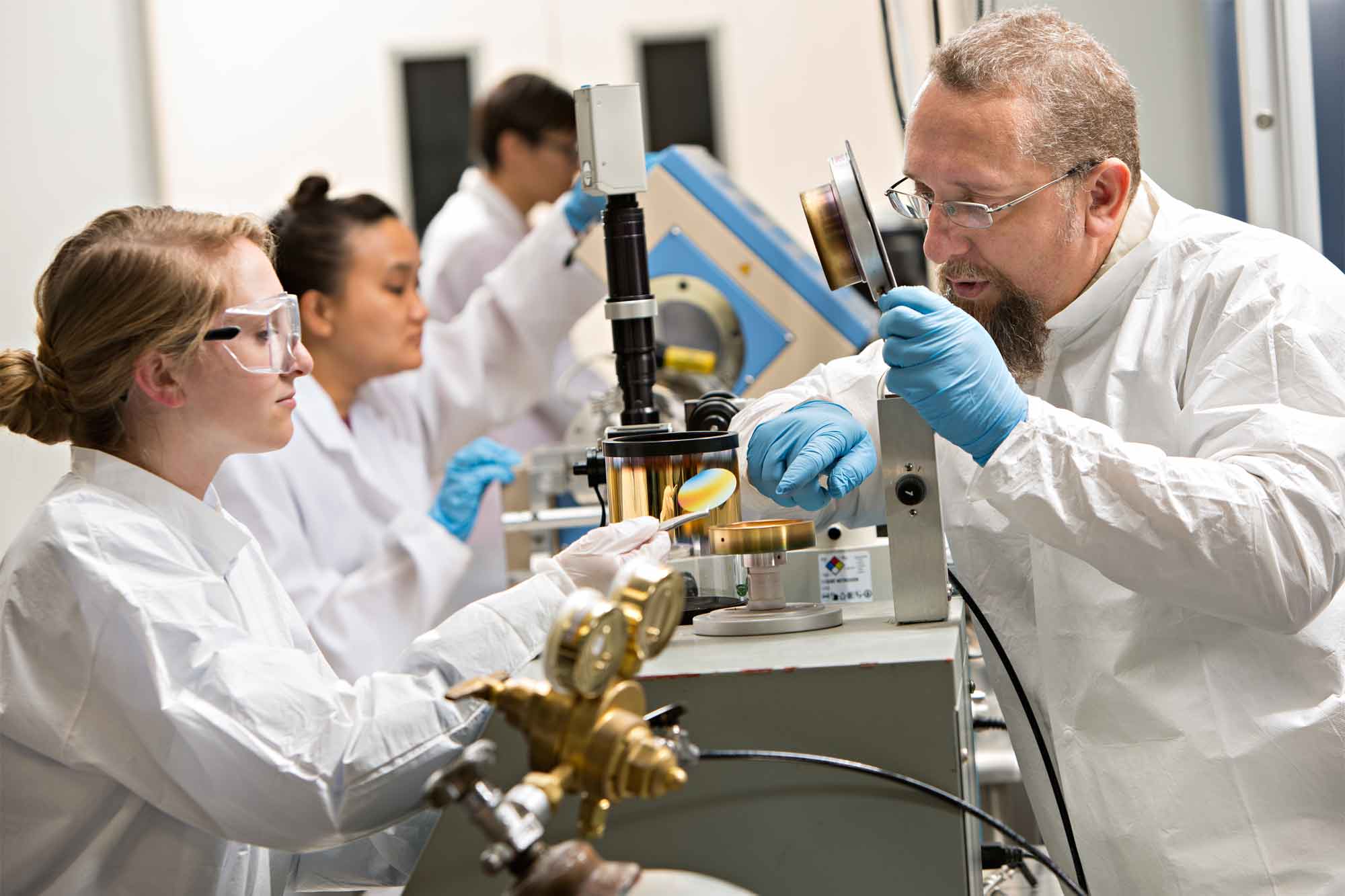 people in lab doing research